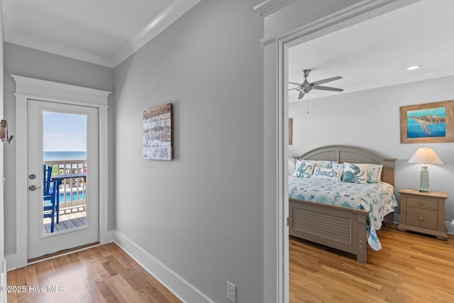 doorway to outside featuring baseboards, recessed lighting, ceiling fan, and wood finished floors