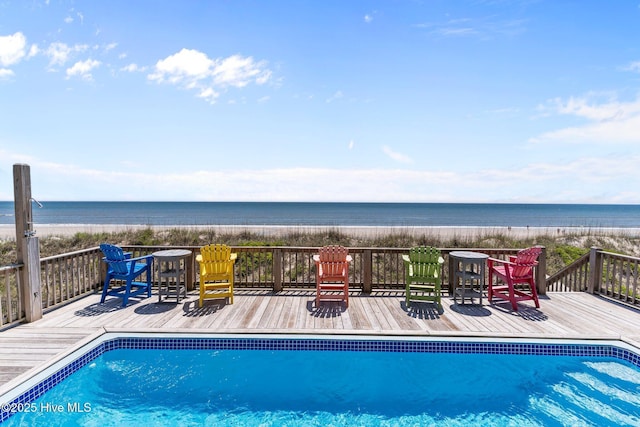 pool with a beach view and a deck with water view