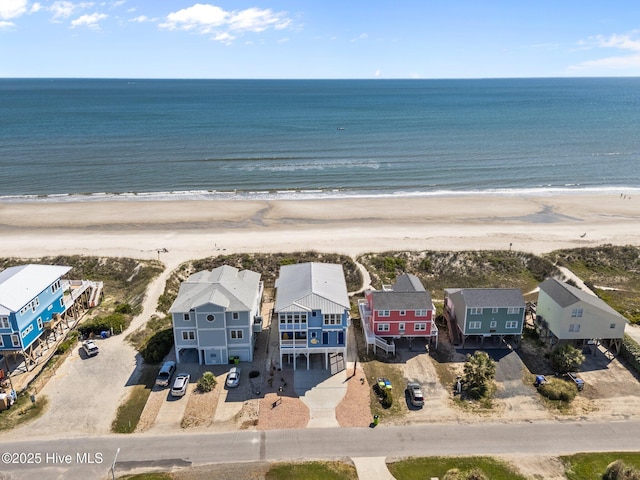 aerial view with a view of the beach and a water view