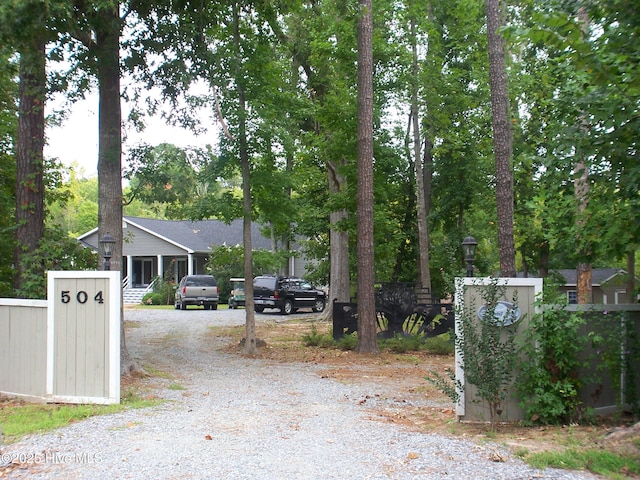 view of street with gravel driveway