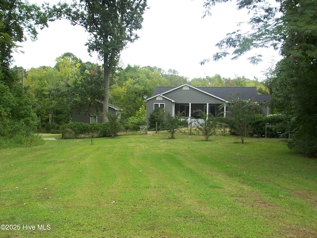 view of yard featuring a sunroom