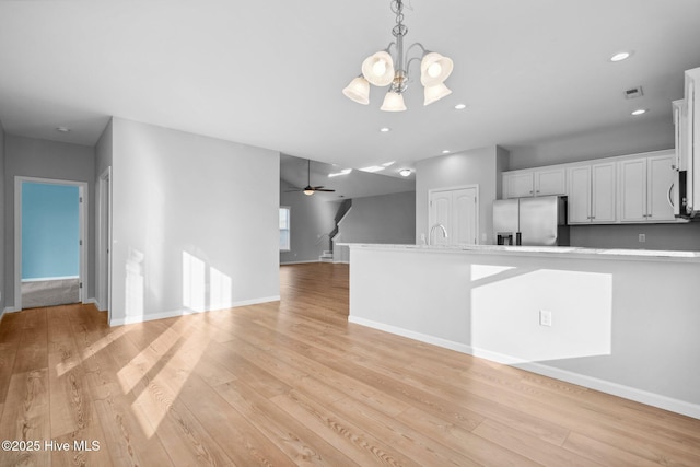 interior space with recessed lighting, visible vents, baseboards, and light wood-style floors