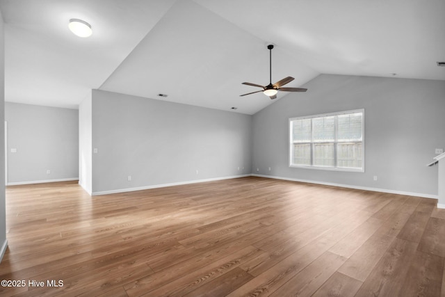 unfurnished living room with lofted ceiling, light wood-style floors, baseboards, and ceiling fan