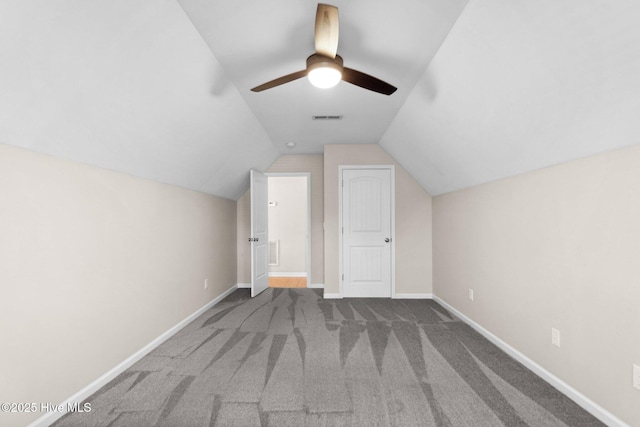 bonus room with visible vents, carpet, baseboards, ceiling fan, and vaulted ceiling