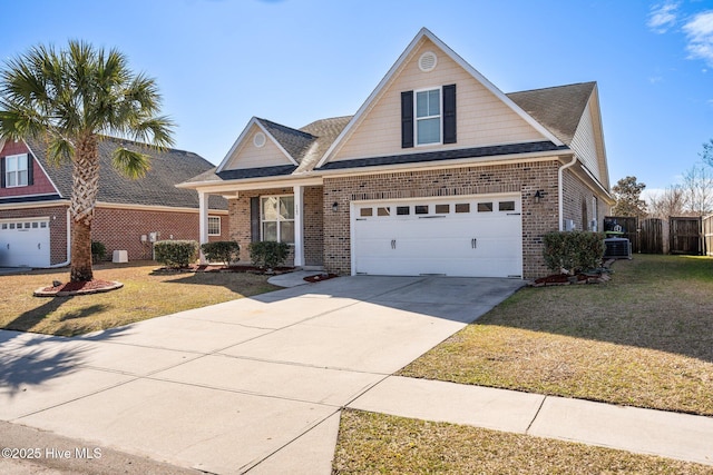 traditional-style house with brick siding, roof with shingles, concrete driveway, and a front lawn