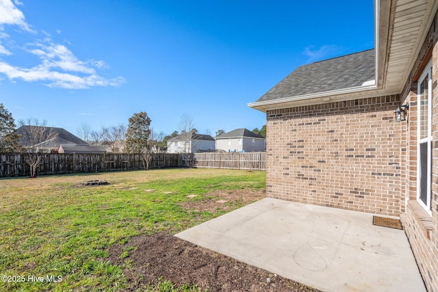 view of yard with a patio area and a fenced backyard