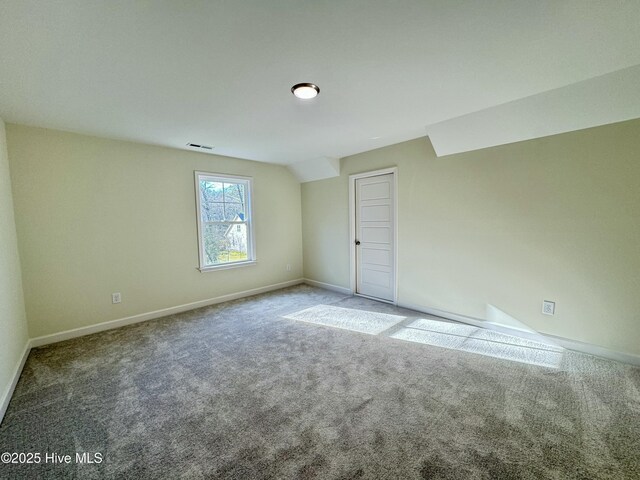 spare room with visible vents, baseboards, and crown molding