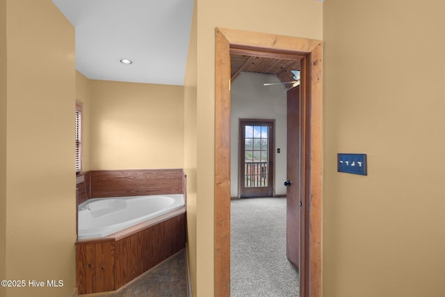 bathroom with a garden tub