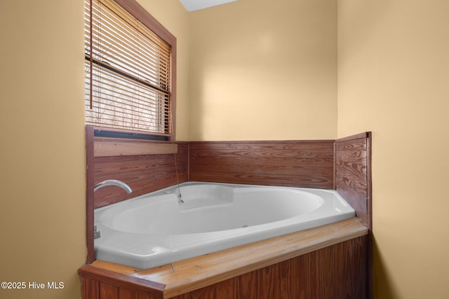 bathroom with a garden tub