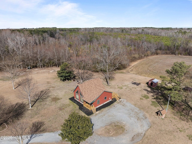 birds eye view of property with a rural view