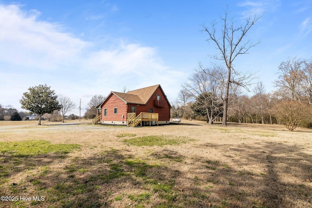 view of yard with a wooden deck