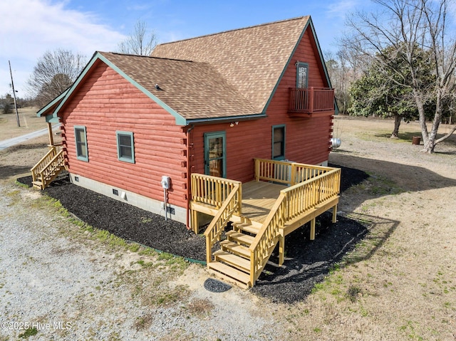 back of property with stairway, roof with shingles, log siding, crawl space, and a deck