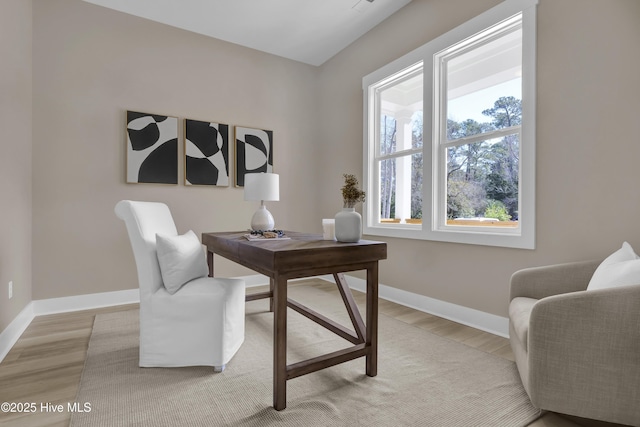 office space featuring light wood-style floors and baseboards