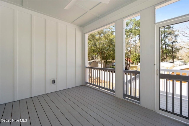 deck with an outdoor structure and a storage shed