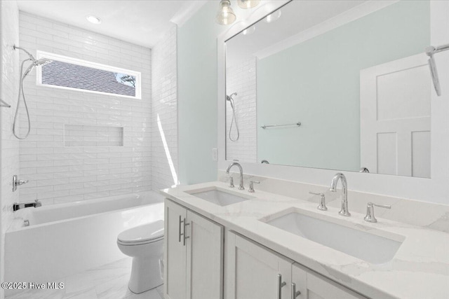 full bath featuring double vanity, a sink, toilet, and shower / bathtub combination