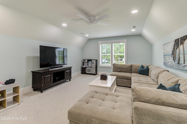 living room with baseboards, visible vents, light carpet, and lofted ceiling