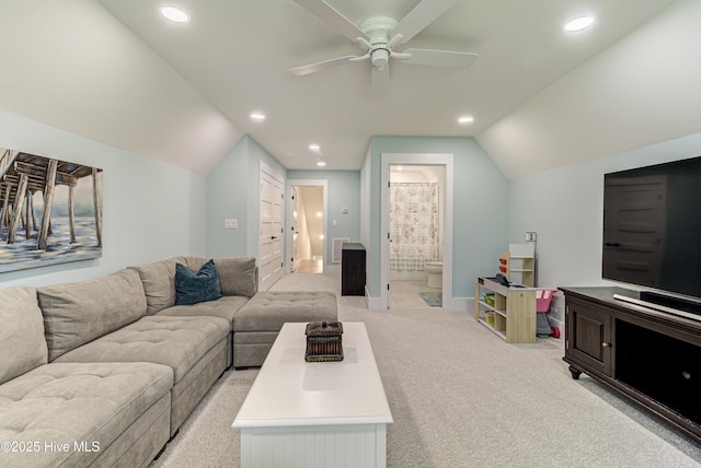 living area featuring lofted ceiling, recessed lighting, light colored carpet, and visible vents