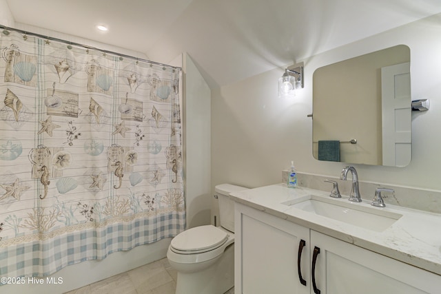 bathroom featuring toilet, shower / tub combo with curtain, and vanity