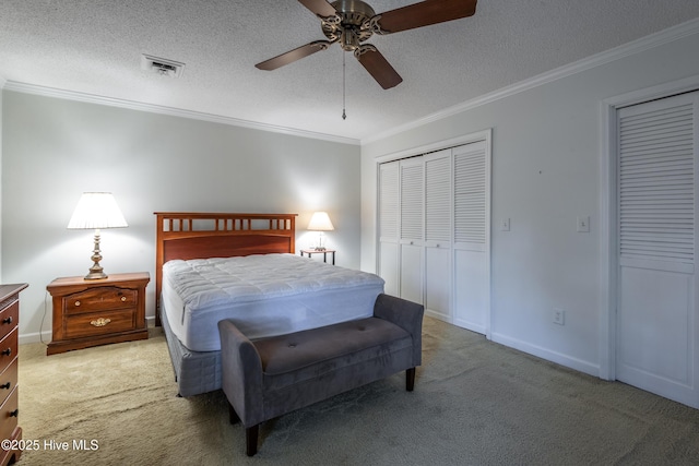 bedroom featuring visible vents, crown molding, and carpet