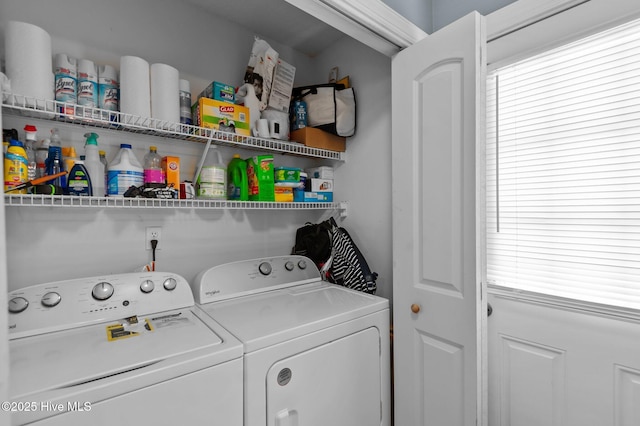 clothes washing area featuring laundry area and independent washer and dryer