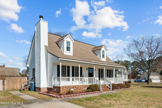 cape cod house featuring a shingled roof, fence, a front yard, covered porch, and a chimney