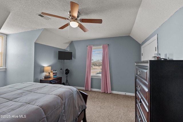 bedroom featuring visible vents, baseboards, vaulted ceiling, light carpet, and a ceiling fan