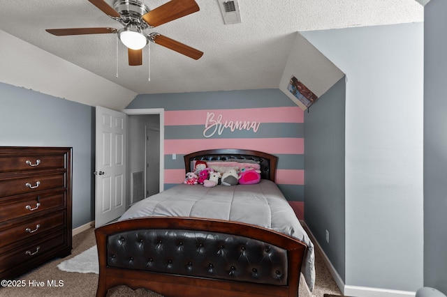 bedroom featuring visible vents, a textured ceiling, lofted ceiling, and carpet floors