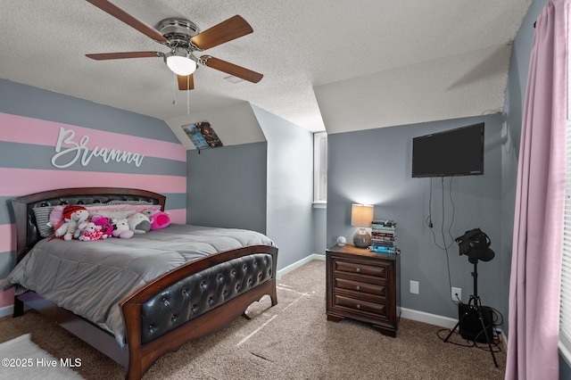 carpeted bedroom with vaulted ceiling, baseboards, and a textured ceiling