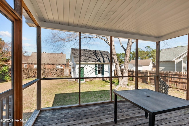 unfurnished sunroom with a wealth of natural light