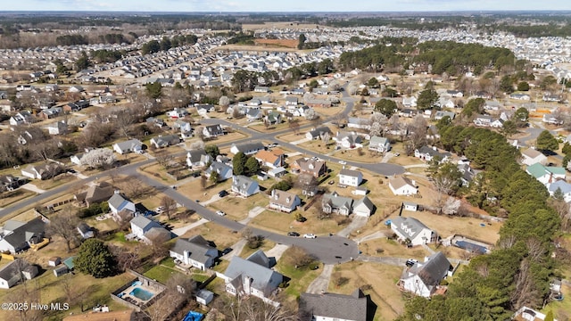 birds eye view of property with a residential view