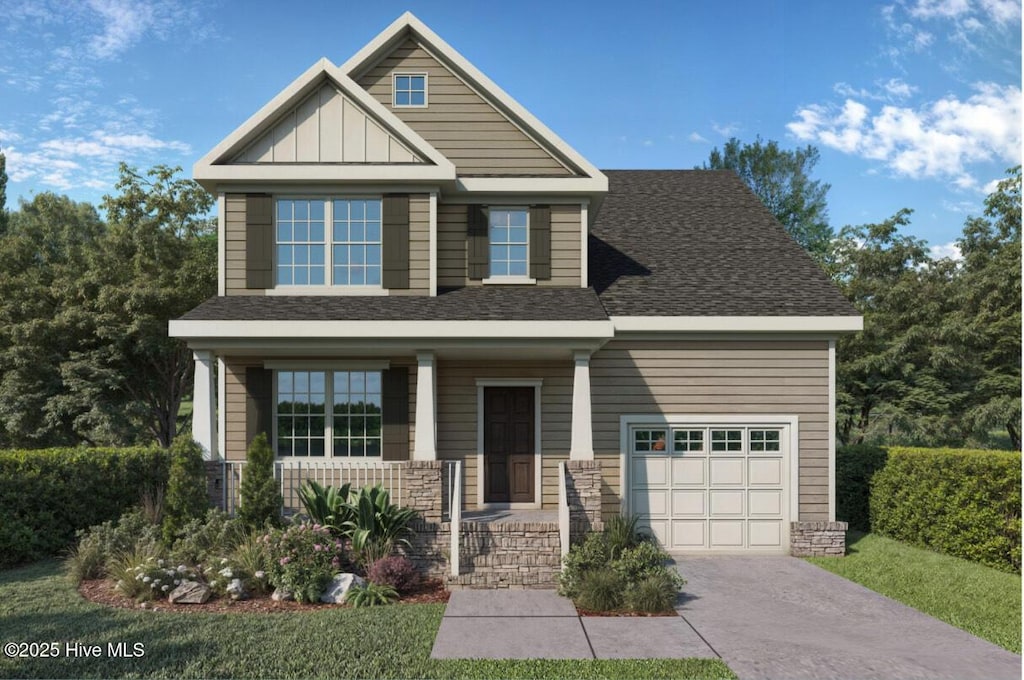 craftsman-style home with board and batten siding, a shingled roof, covered porch, a garage, and driveway