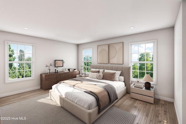 bedroom featuring recessed lighting, baseboards, and light wood-type flooring