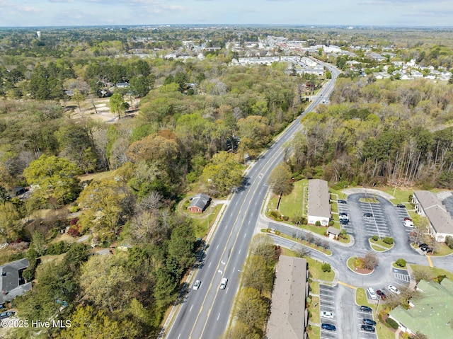 bird's eye view featuring a wooded view