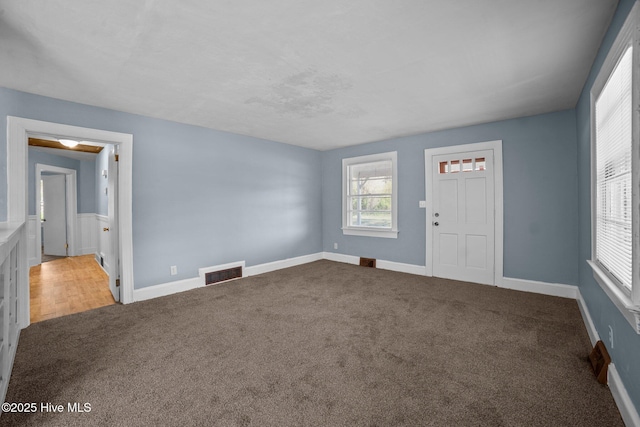 interior space with visible vents and carpet