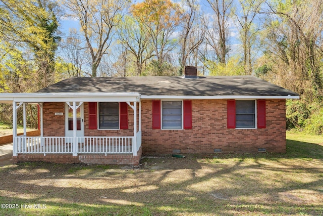 ranch-style home featuring a front yard, a porch, a chimney, crawl space, and brick siding