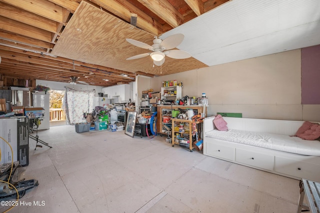 garage with white fridge and ceiling fan