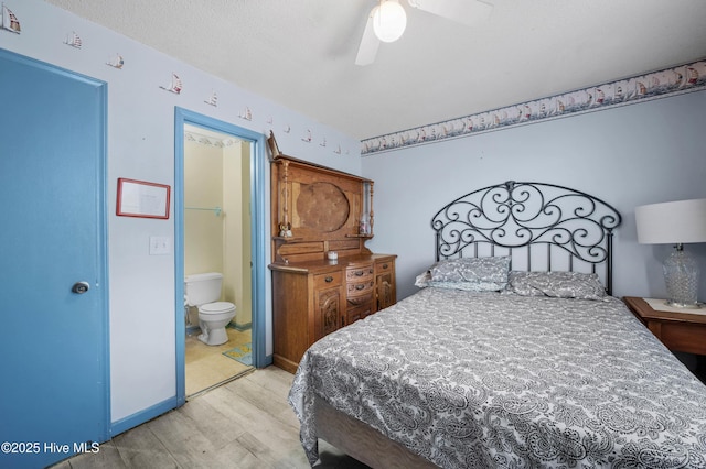 bedroom featuring baseboards, ceiling fan, connected bathroom, and light wood-style floors