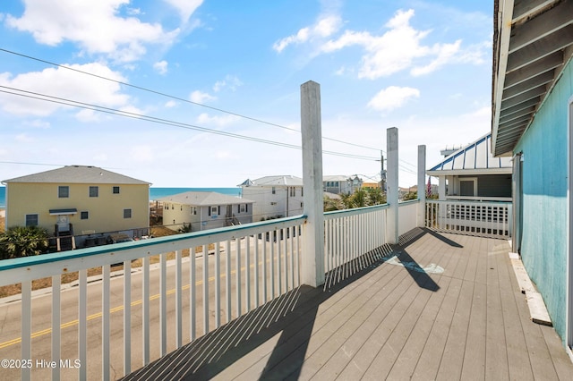 wooden deck with a residential view