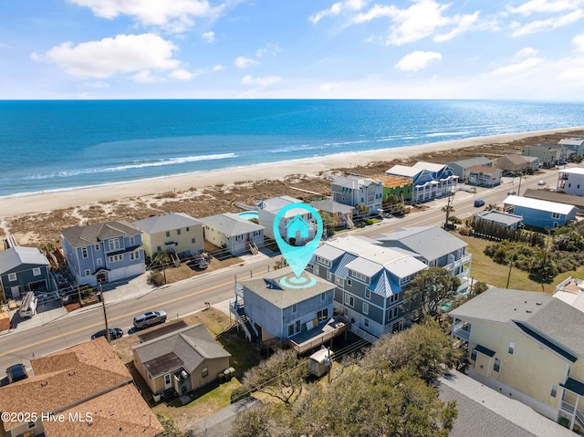 bird's eye view featuring a residential view, a beach view, and a water view