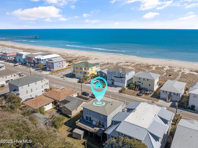 birds eye view of property featuring a residential view, a beach view, and a water view