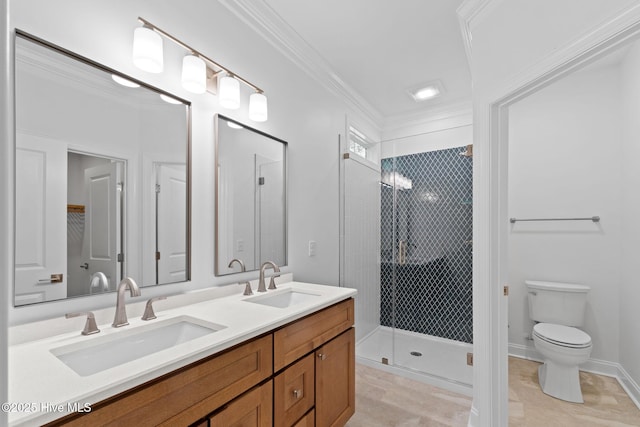 full bath featuring a sink, a shower stall, toilet, and double vanity