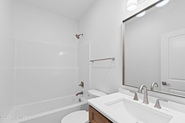 full bathroom with vanity, bathtub / shower combination, and toilet