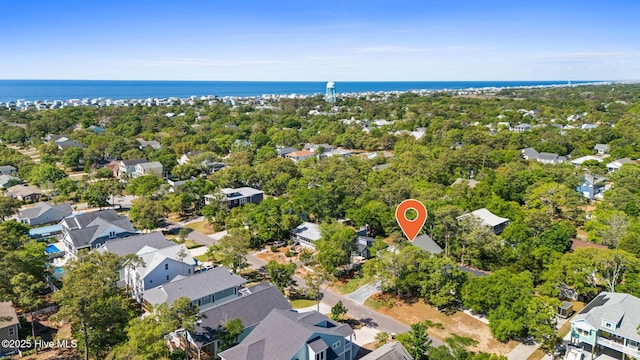 birds eye view of property with a water view and a residential view