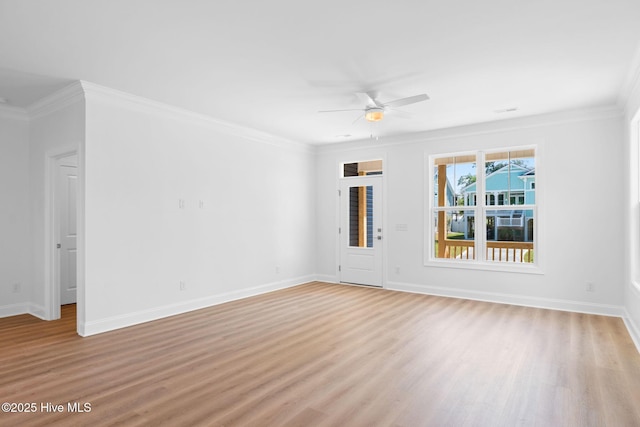 empty room with crown molding, a ceiling fan, and light wood-type flooring