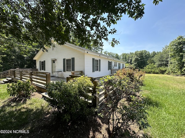 view of home's exterior with a deck