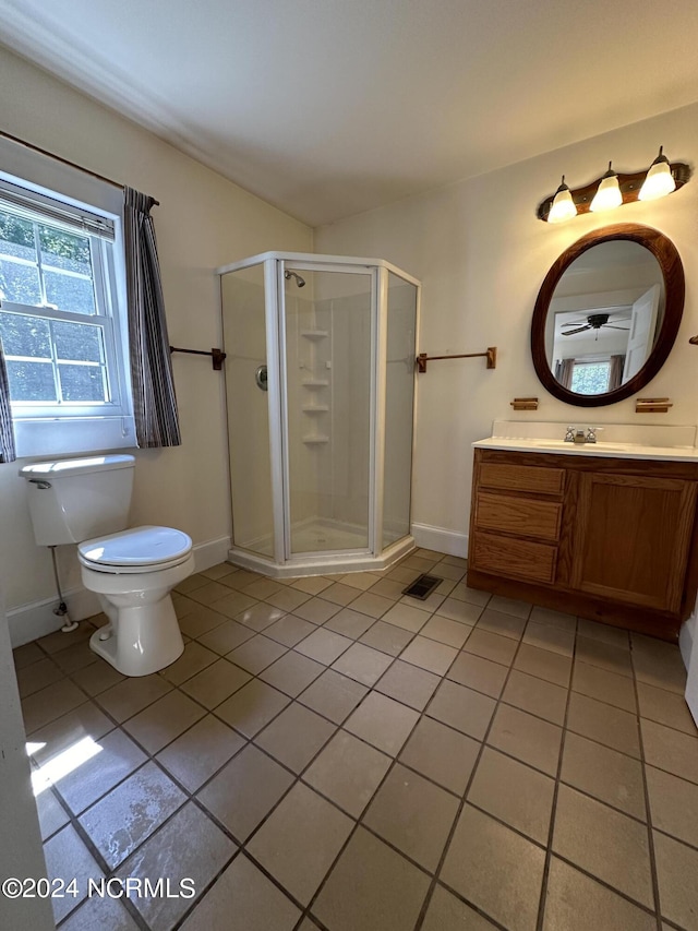 full bathroom with vanity, baseboards, a shower stall, tile patterned floors, and toilet