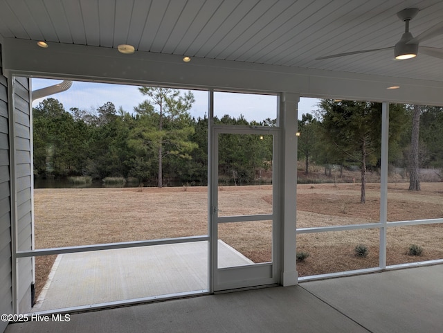 unfurnished sunroom with wood ceiling and ceiling fan