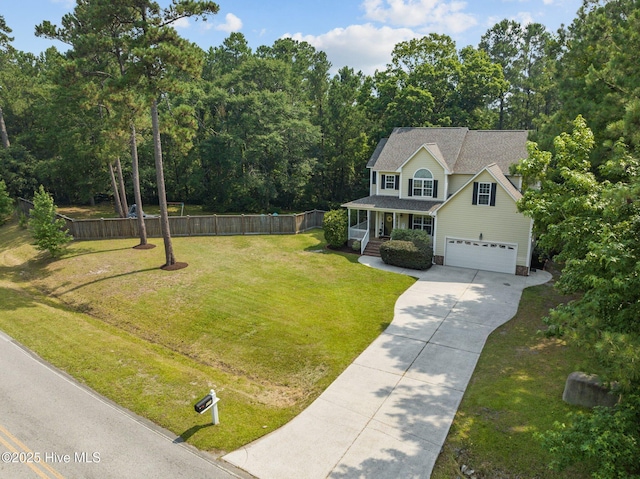 view of front of property featuring fence, driveway, an attached garage, a shingled roof, and a front lawn