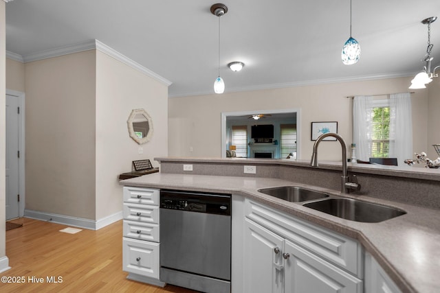 kitchen with light wood finished floors, white cabinetry, a sink, dishwasher, and crown molding