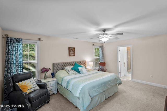 bedroom featuring baseboards, light carpet, and a ceiling fan